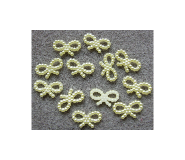 AK-AP351018 Akrilinė aplikacija "Bantukas", (prisiuvama, klijuojama), 10x18mm, kreminė-gelsva