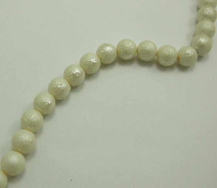 PER-68675 Perliukas stikl. dekor., 12mm, kreminės sp.